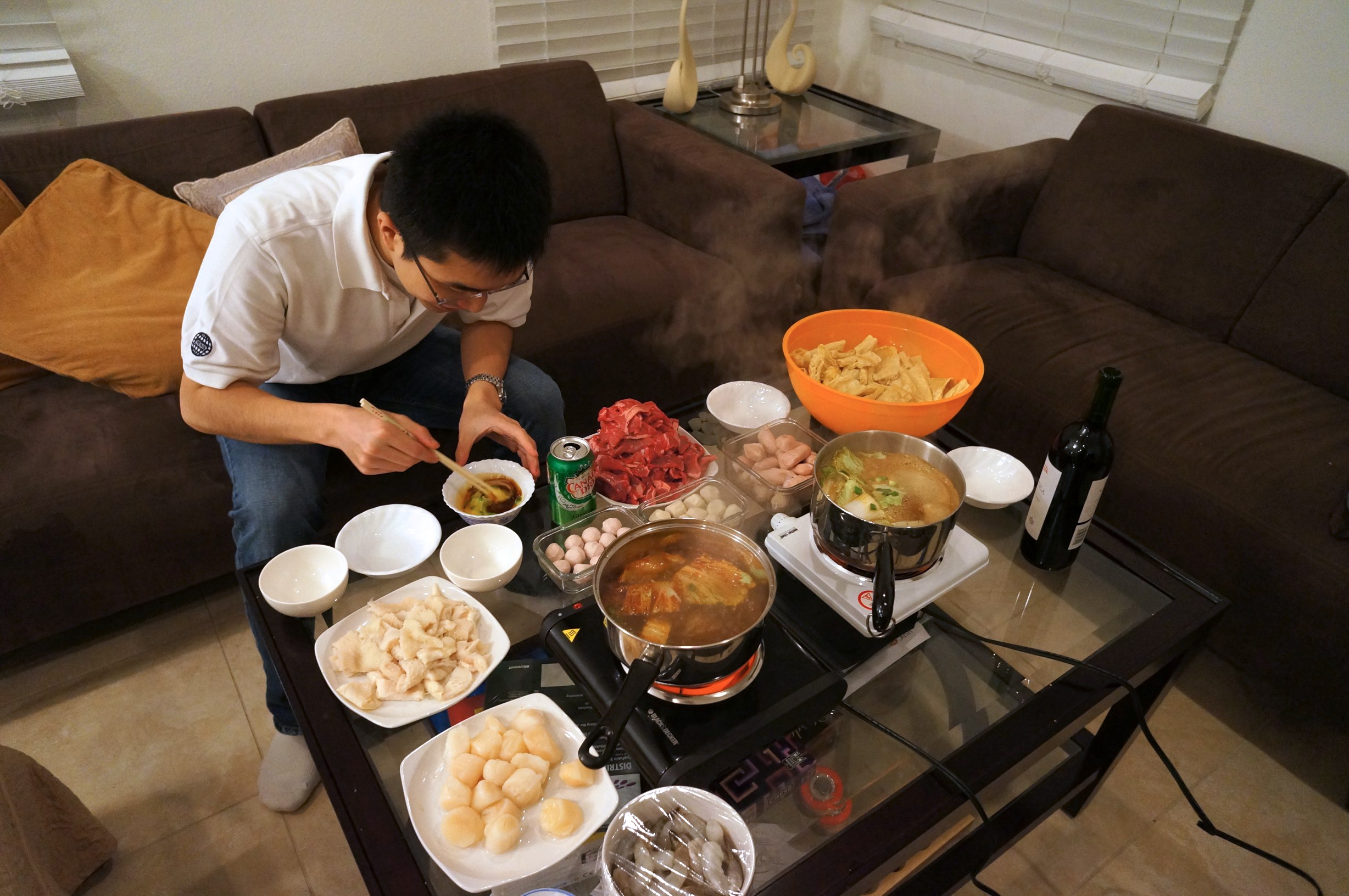 Alvin mixing his sauce